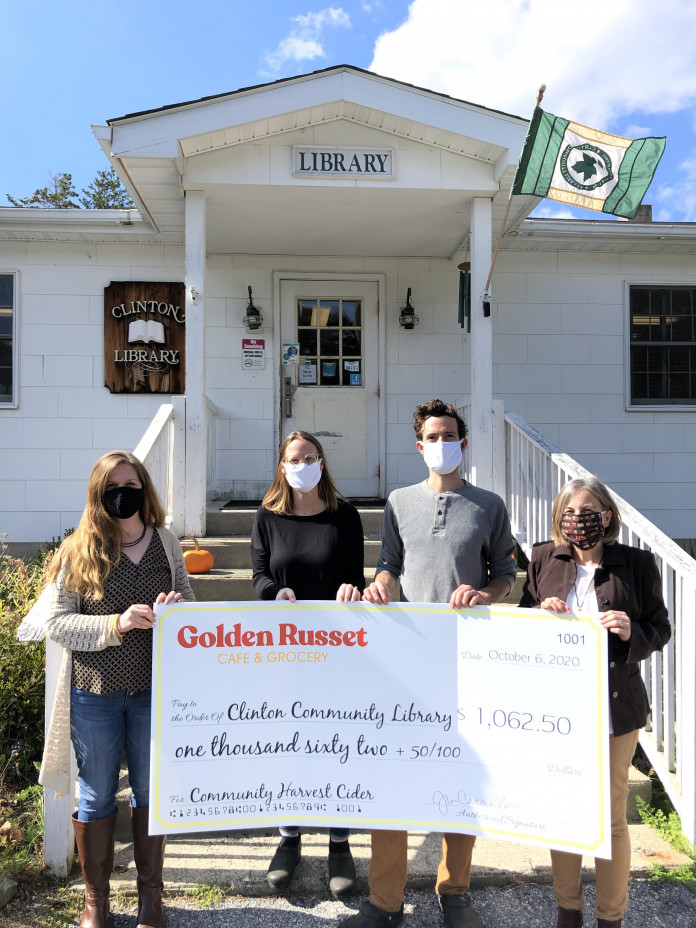 The Cavallos present their donation check to the Clinton Library on October 6. (L to r) Carol Bancroft, Library Director; Jenny & Craig Cavallo, co-owners Golden Russet Cafe & Grocery; Mary Pat Sternberg, Clinton Library Board of Trustees President